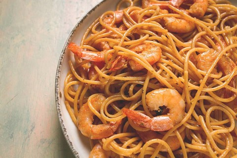 Spaghetti with king shrimps, with spices, top view, selective focus, homemade, no people