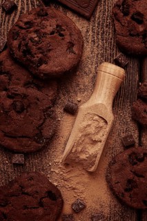 Dark chocolate cookies, with chocolate chips, on a wooden table, selective focus, close-up, no