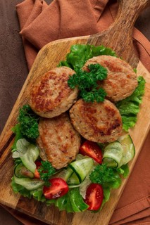 Fried cutlets, turkey, with vegetable salad, top view, no people