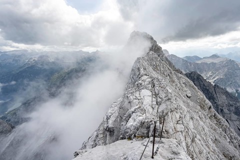 Clouds around a narrow rocky ridge, Watzmann crossing to Watzmann Mittelspitze, view of mountain