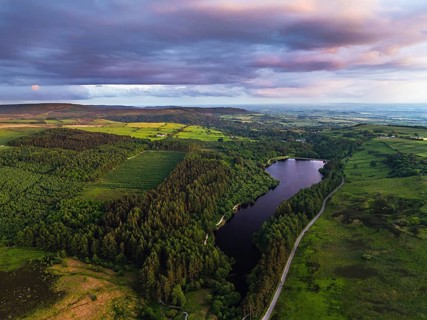 Sunset over Cod Beck Reservoir from a drone, North York Moors National Park, North Yorkshire,