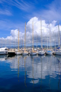 Water reflection, sailing boats in the harbour of Saint Tropez, Var, French Riviera,