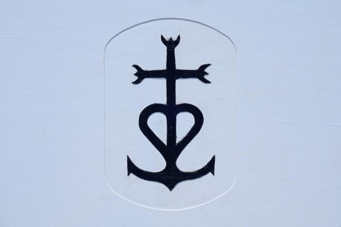 Picture with the cross of the Camargue, in front of a white background, bullfighting arena,