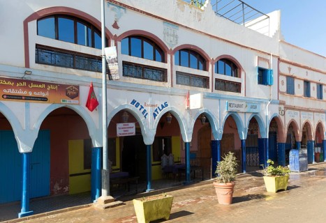 Historic buildings shops and hotel in arcaded shopping street in town centre, Mirleft, southern