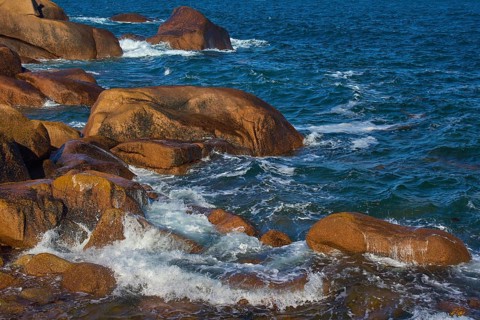 Large granite rose rocks, in the middle of the sea, lapped by waves, Ploumanach, Cote De Granit