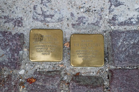 Two Stumbling Stones embedded in the pavement as memorials against forgetting the injustice of