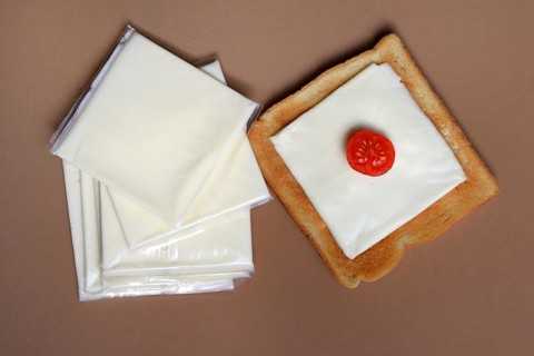 Cheese slices with toast, processed cheese in packaging