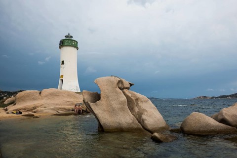 Lighthouse with beach and bizarre granite rocks, Spiaggia Porto Faro, Faro di Punta Palau, Palau,