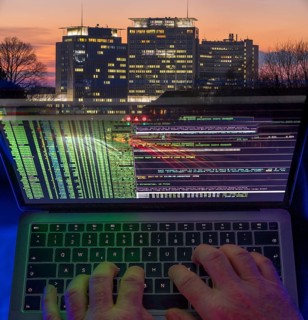 Symbolic image hacker, cyber attack on public buildings, administrations, institutions, town hall,