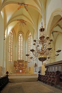 Choir room with altar and choir stalls, interior view, Gothic, chandelier, high altar with