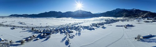Aerial view of a village in front of mountains, sun, snow, winter, panorama, Schlehdorf, view of