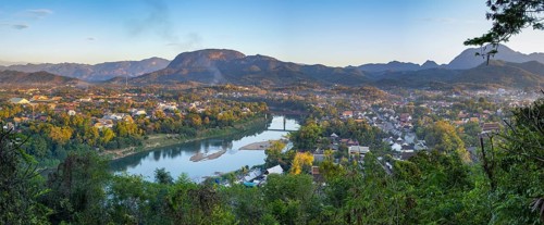 Panorama over Luang Prabang with Nam Khan River and Wat Phol Pao in the background, Laos, Asia