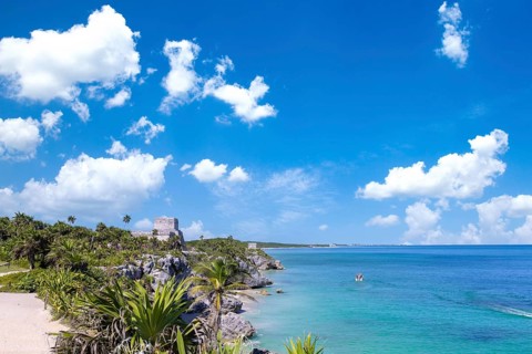 Mexico, Tulum Archaeological Zone and Mayan pyramids on scenic ocean shore, Central America