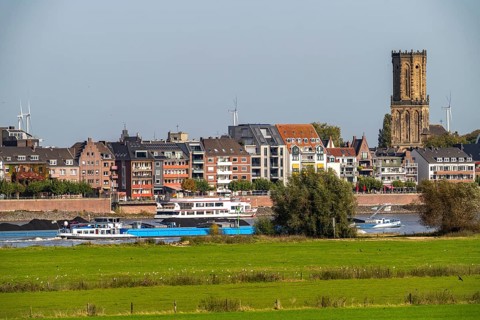 Skyline of Emmerich, on the Lower Rhine, left bank of the Rhine, cargo ship, St. Aldegundis Church,