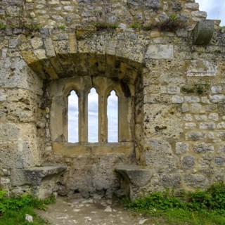 Gothic tracery window in an old fragment of wall, ruins of the medieval Hohenurach Castle, Bad