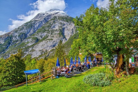 Restaurant terrace of the Landgasthof Ropferstubn above the Inn Valley in front of the Hohe Munde