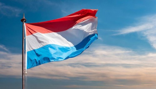Flags, the national flag of Luxembourg flutters in the wind