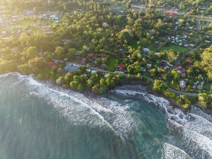 Top-down, aerial view, view of settlement and houses on the coast, Cahuita, Limón, Costa Rica,