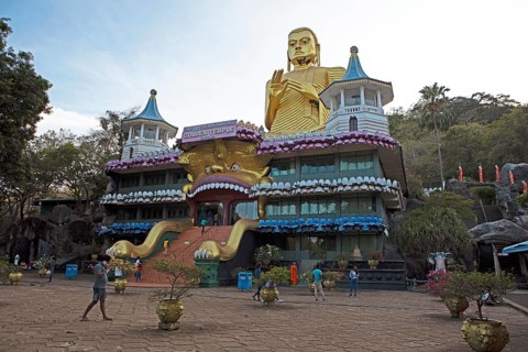 Buddha statue at the entrance to the Dambulla cave temple, Dambulla, Central Province, Sri Lanka,