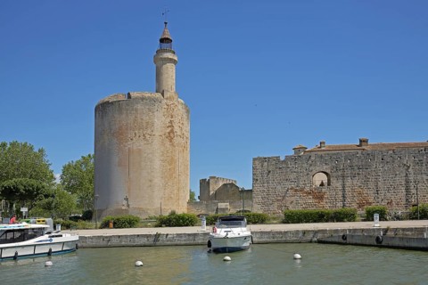 Marina with yachts and Tour de Constance, defence defence tower and landmark, historic town