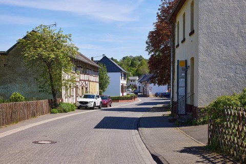 Street with residential buildings through the Schönau district, Bad Münstereifel, Eifel, Euskirchen