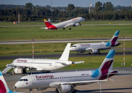 Düsseldorf Airport, Eurowings aircraft, on the taxiway and parking position, Iberia aircraft taking