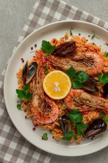 Seafood paella, shrimp and mussels risotto, rice, homemade, top view, no people