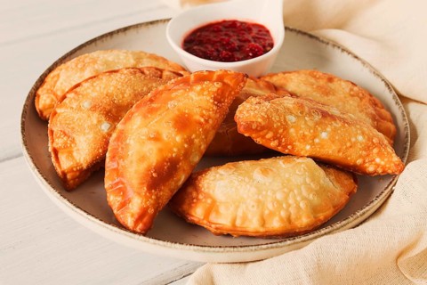 Fried chebureks, close-up, on a light background, no people