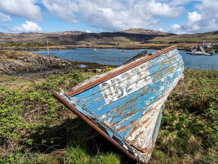 Ulva isle, boat on the shore, view to Isle of Mull, Ulva, Scotland, UK