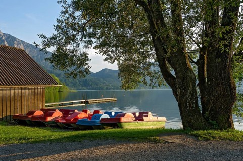 Pedal boats on the jetty in the evening light, boat hire, lakeside promenade of Kochel am See, Lake