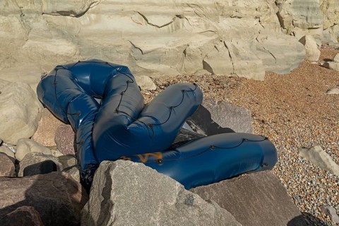 Damaged inflatable boat on the beach, Samphire Hoe Landscape Park, Kent, England, United Kingdom,