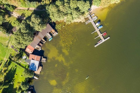 Aerial view of boat sheds at lake Schwarzer See, Mecklenburg lake district, Mecklenburg-Vorpommern,