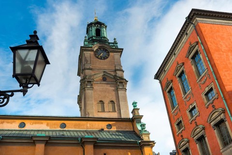 Houses and church in an alley of Gamla Stan, old town, centre, attraction, famous, city centre,