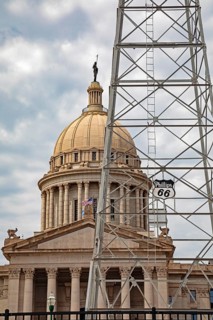 Oklahoma City, Oklahoma, A Phillips 66 oil derrick in front of the Oklahoma state capitol building