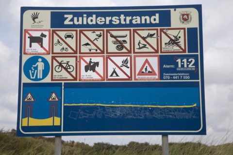 Sign with beach rules Zuiderstrand near Scheveningen Holland