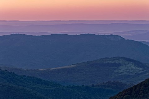 Dawn over the mountain landscape of the Balkan Mountains and the wooded slopes of the Balgarka
