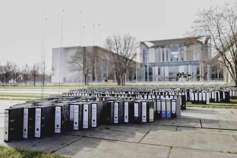 File folders stand in front of the Federal Chancellery as part of a protest action by the German
