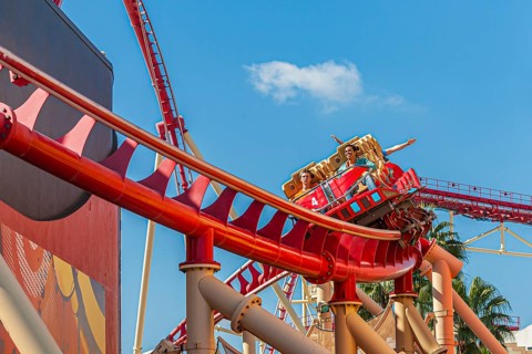 Park guests riding the Hollywood Rip Ride Rockit roller coaster at Universal Studios in Orlando,