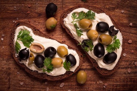 Breakfast, sandwiches, with cream cheese, olives, top view