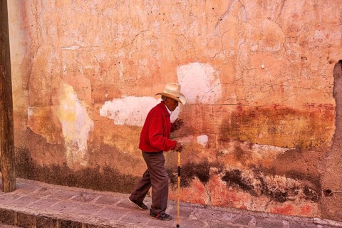 San Miguel de Allende, Mexico-3 December, 2018: Old man walking down the streets of San Miguel de