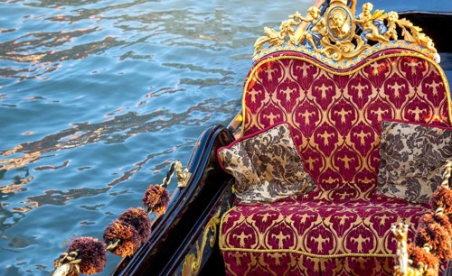 Luxury Gondola waiting for tourists near famous Rialto Bridge in Venice