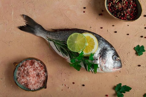 Fresh, raw dorado fish, top view, no people