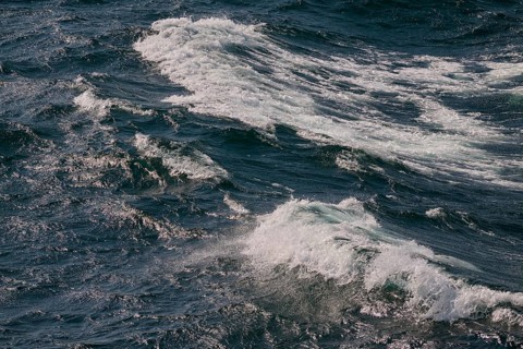 Dynamic sea waves with foaming water in different shades of blue, North Sea, Denmark, Europe