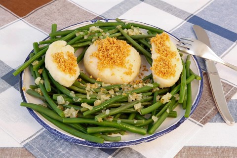 Swabian cuisine, yeast dumplings with green beans, breadcrumbs, served on a plate, typical Swabian,
