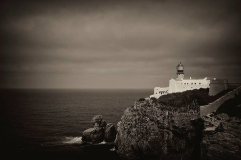 Lighthouse Farol do Cabo de São Vicente, Cape St. Vincent, Sagres, cliffs, Atlantic Ocean, black