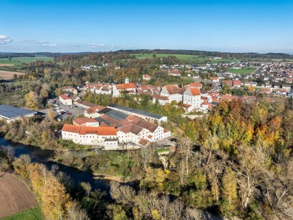 Aerial view of the village of Scheer with the residential palace and the former Kraemer paper mill,