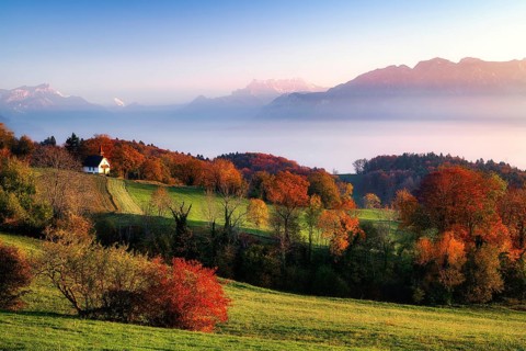 View of Dents du Midi at sunset, fog over Lake Geneva, Vevey, Canton of Vaud, Switzerland, Europe