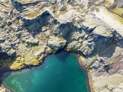 Lake in Tjarnargigur crater, moss-covered Laki crater or Lakagígar, series of craters, aerial view,
