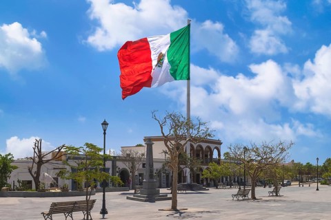 Los Cabos San Jose Del Cabo, Mexico, Mexican tricolor national striped flag proudly waving at mast,
