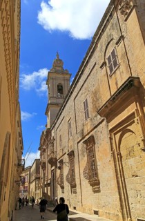 Historic buildings and Carmelite church and priory inside the medieval city of Mdina, Malta, Europe